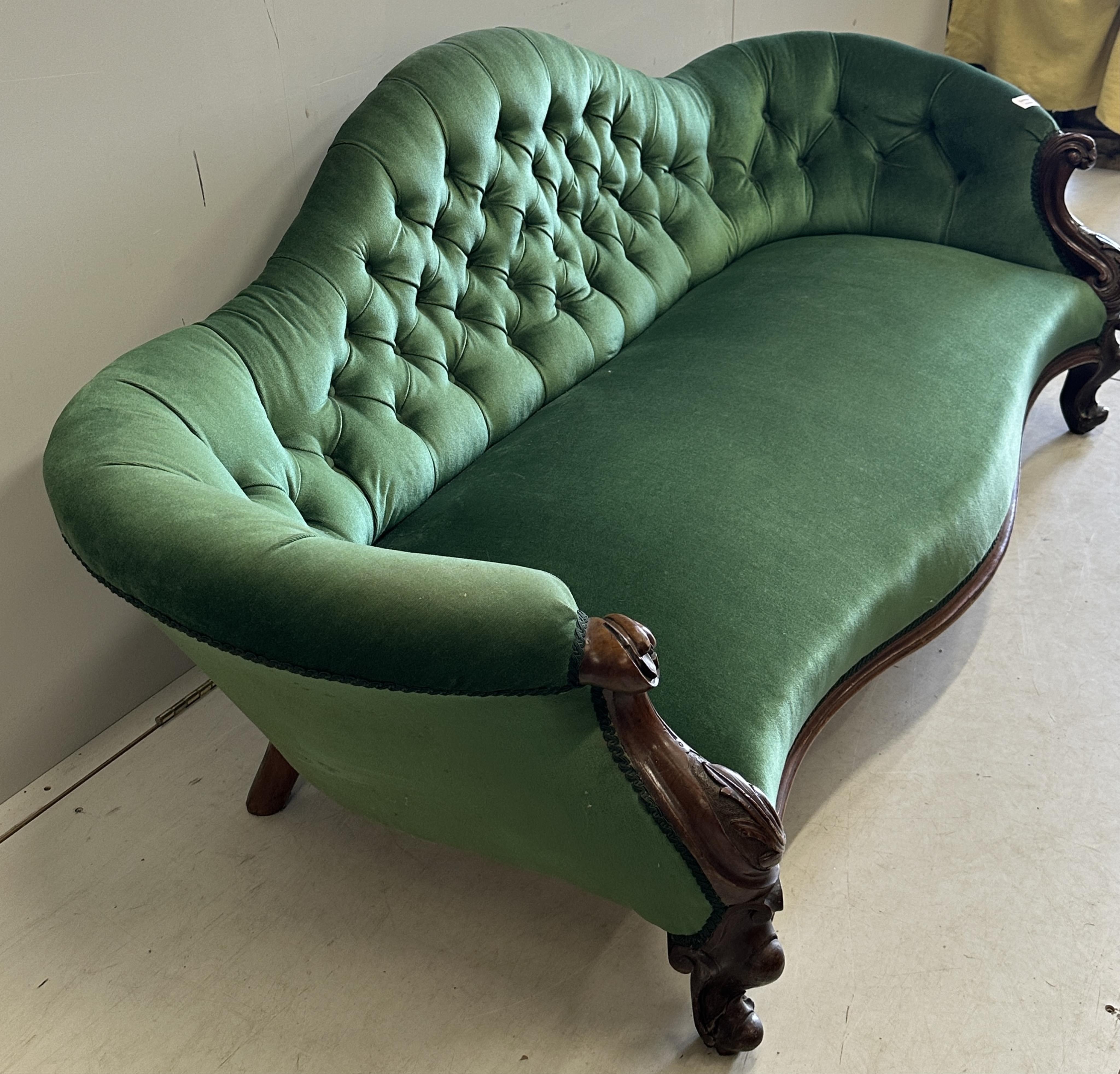 A Victorian rosewood scroll arm deep back buttoned settee, width 184cm, depth 76cm, height 74cm. Condition - good
